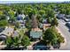 Charming single-Gathering home with lush green surroundings, showcasing its serene neighborhood setting at 4110 Yates St, Denver, CO 80212