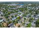 An aerial view shows the neighborhood surrounding the home, with mature trees and Lakeside Amusement Park in the distance at 4110 Yates St, Denver, CO 80212