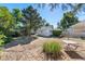 Picturesque backyard featuring a garden area, mature trees, and room for recreation at 4110 Yates St, Denver, CO 80212