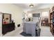 Sun-filled dining room offering neutral walls, bright natural light and offering access to other rooms at 4110 Yates St, Denver, CO 80212