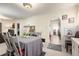 Open concept dining room featuring neutral walls, bright natural light and offering access to other rooms at 4110 Yates St, Denver, CO 80212