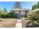 Charming single-story home with a welcoming front porch and well-maintained landscaping at 4110 Yates St, Denver, CO 80212