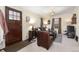 Inviting living room with a comfortable sofa, wood door, and warm lighting, perfect for relaxing at 4110 Yates St, Denver, CO 80212