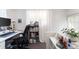 Home office area is naturally well-lit, providing a peaceful workspace for focus and inspiration at 4110 Yates St, Denver, CO 80212
