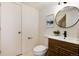 Modern bathroom with a vessel sink, decorative mirror, and stylish fixtures at 9695 E Kansas Cir # 44, Denver, CO 80247