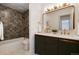 Elegant bathroom featuring double sinks, modern fixtures, and stylish vanity at 9695 E Kansas Cir # 44, Denver, CO 80247