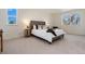 Comfortable primary bedroom featuring carpet, neutral tones, and great natural light at 9695 E Kansas Cir # 44, Denver, CO 80247