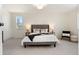 Bright primary bedroom featuring neutral tones, a cozy carpet, and great natural light at 9695 E Kansas Cir # 44, Denver, CO 80247
