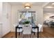 Bright dining area with sliding glass doors leading to the patio and modern white cabinetry at 9695 E Kansas Cir # 44, Denver, CO 80247