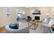 Bright living room featuring a decorative fireplace, modern furniture, and sliding glass doors to the backyard at 9695 E Kansas Cir # 44, Denver, CO 80247