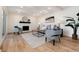 Bright living room featuring a decorative fireplace, modern furniture, and contemporary decor at 9695 E Kansas Cir # 44, Denver, CO 80247