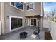 Private outdoor patio area with pavers, a fire pit, and access to the home at 9695 E Kansas Cir # 44, Denver, CO 80247