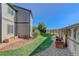 Backyard featuring a lush green lawn and garden beds, offering a serene outdoor space at 11680 Crow Hill Dr, Parker, CO 80134