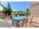 Outdoor patio area featuring brick pavers, lush green grass, and a serene backyard view at 11680 Crow Hill Dr, Parker, CO 80134