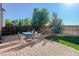 Relaxing backyard patio with brick pavers, seating, and well-maintained landscaping at 11680 Crow Hill Dr, Parker, CO 80134