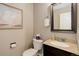 Well-appointed half bathroom with stylish fixtures, vanity, mirror, and tasteful decor at 11680 Crow Hill Dr, Parker, CO 80134