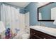 Charming bathroom featuring a tiled shower, vanity, toilet, and mirror at 11680 Crow Hill Dr, Parker, CO 80134