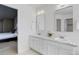 Modern bathroom features double sinks, quartz countertops, natural light, and large mirrors at 11680 Crow Hill Dr, Parker, CO 80134