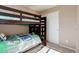 Bedroom featuring bunk beds with a ladder and additional space for storage at 11680 Crow Hill Dr, Parker, CO 80134