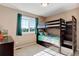 Bedroom with a bunk bed, plenty of storage, and natural light at 11680 Crow Hill Dr, Parker, CO 80134