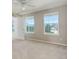 Bright bedroom with neutral walls, ceiling fan, and large windows providing ample natural light at 11680 Crow Hill Dr, Parker, CO 80134
