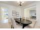 Charming dining room with a dark table, seating for six, and neutral paint at 11680 Crow Hill Dr, Parker, CO 80134