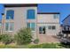 Exterior of the home showing large windows, siding, patio, and landscaping at 11680 Crow Hill Dr, Parker, CO 80134