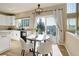 Bright eat-in kitchen area featuring a sliding glass door and stainless steel dishwasher at 11680 Crow Hill Dr, Parker, CO 80134