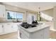 Kitchen island featuring a cooktop and countertop with a sliding glass door at 11680 Crow Hill Dr, Parker, CO 80134