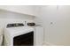 Convenient laundry room with modern washer and dryer, plus a useful storage shelf at 11680 Crow Hill Dr, Parker, CO 80134