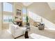 Bright living room with tall windows, a fireplace, and stylish, comfortable seating at 11680 Crow Hill Dr, Parker, CO 80134