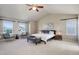 Spacious main bedroom features vaulted ceilings, neutral tones, and plenty of natural light from double windows at 11680 Crow Hill Dr, Parker, CO 80134