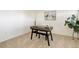 Minimalist office space with carpet, decor, and a stylish desk with modern black legs at 11680 Crow Hill Dr, Parker, CO 80134