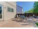 Cozy brick patio with outdoor seating, perfect for relaxing and entertaining at 11680 Crow Hill Dr, Parker, CO 80134