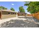 Spacious gravel backyard with garage and fence, offering ample parking and outdoor possibilities at 951 S Osage St, Denver, CO 80223