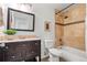 Well-appointed bathroom with vanity, toilet, and tiled shower/tub combo at 951 S Osage St, Denver, CO 80223