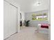 Bright bedroom featuring a fireplace, closet, and natural light streaming through a large window at 951 S Osage St, Denver, CO 80223