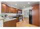 Stylish kitchen with stainless appliances, granite counters, and wood cabinets at 951 S Osage St, Denver, CO 80223