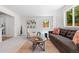 Bright living room featuring modern decor, neutral color palette, and abundant natural light at 951 S Osage St, Denver, CO 80223