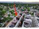 Aerial view showcasing modern townhomes with rooftop decks in a green residential area at 3030 Wilson Ct # 5, Denver, CO 80205