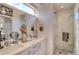 Modern bathroom features double sinks, a stylish glass shower, and contemporary fixtures for a luxurious feel at 3030 Wilson Ct # 5, Denver, CO 80205