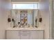 Bright bathroom featuring double vanity, large mirror, and modern lighting fixtures at 3030 Wilson Ct # 5, Denver, CO 80205
