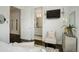 Bedroom showcasing elegant decor, a comfortable chair, and a glimpse into an adjacent bathroom with modern finishes at 3030 Wilson Ct # 5, Denver, CO 80205