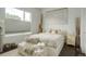 Bright bedroom with a large window, soft textures, and serene decor at 3030 Wilson Ct # 5, Denver, CO 80205