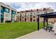 Well-maintained common area with green space, outdoor seating, and modern architecture at 3030 Wilson Ct # 5, Denver, CO 80205