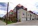 Modern townhome exterior with clean lines, rooftop decks, and attached garages at 3030 Wilson Ct # 5, Denver, CO 80205
