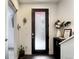 Inviting entryway with a modern, frosted glass door and stylish decor at 3030 Wilson Ct # 5, Denver, CO 80205