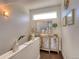 Hallway with an upper view of a console table, decor, bright window, and hardwood floors at 3030 Wilson Ct # 5, Denver, CO 80205