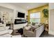Cozy living room showcasing a modern fireplace, stylish wallpaper, and comfortable seating for relaxation and entertainment at 3030 Wilson Ct # 5, Denver, CO 80205