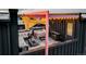 Aerial view of a cozy rooftop deck with hot tub, stylish furniture, and pergola with string lights at 3030 Wilson Ct # 5, Denver, CO 80205